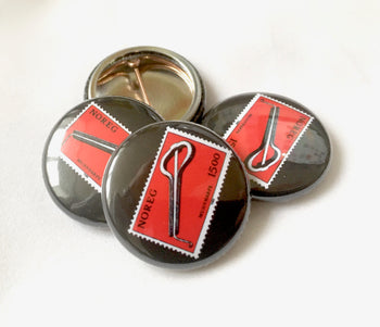 Jaw harp button badge